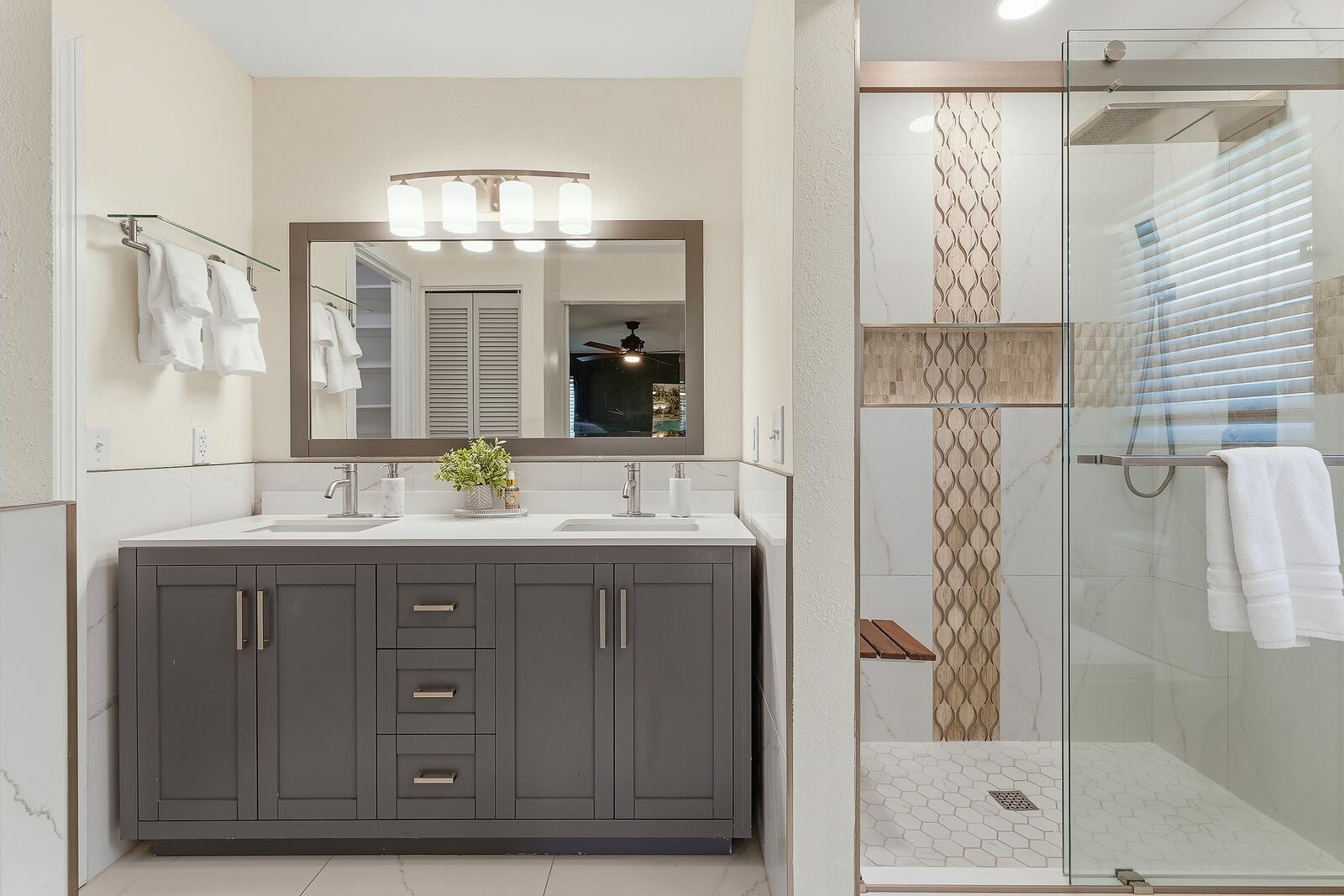 Bathroom with double vanity and walk-in shower