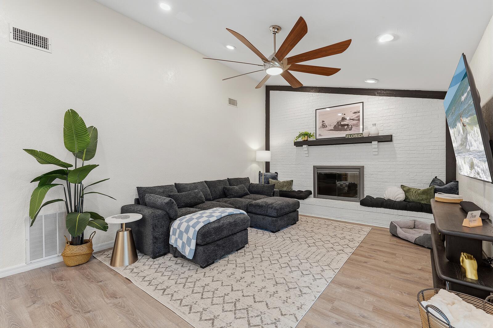 Living room with sectional sofa and fireplace